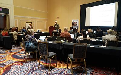 Attendees actively listen to a presentation.