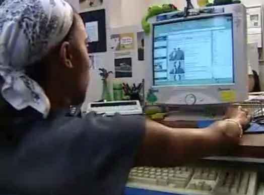 still image from video Learning and Earn Tips showing DO-IT Scholar using assistive technology at computer