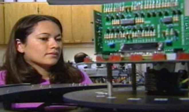 still image from STEM showing student in an electronics lab