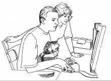 An instructor helping a student on the computer.