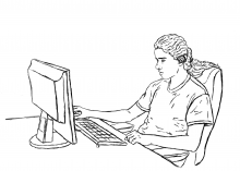 A student with a cochlear working on a computer.