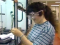 still image from video College YCDI showing DO-IT Scholar performing a science experiment