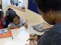 still image from video Taking Charge 3 showing DO-IT Scholar Jessie working with a mentor