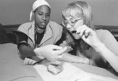 Tynesha and Danielle at heart surgery workshop lab