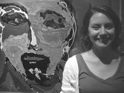 DO-IT Mentor Kim Borowicz in the HUB Picture of Kim in front of artwork.