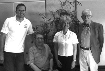 DO-IT Director Sheryl Burgstahler and Program Manager Michael Richardson with 2007 Trailblazer Award recipients Dennis Lang and Ray Bowen. Picture of Michael, Dennis, Sheryl, and Ray.