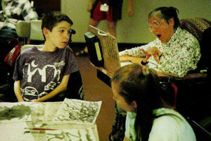 DO-IT Mentor and Sumi Instructor Sharon Jodock-King gives some timps to Phase II Scholar Andrew Picture of Andrew receiving some tips fromt the instructor