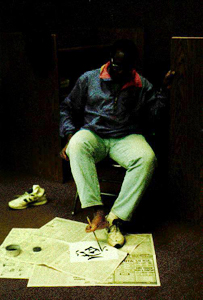 DO-IT Mentor Dan Locke tries a new way of painting Picture of Dan Locke painting with his feet