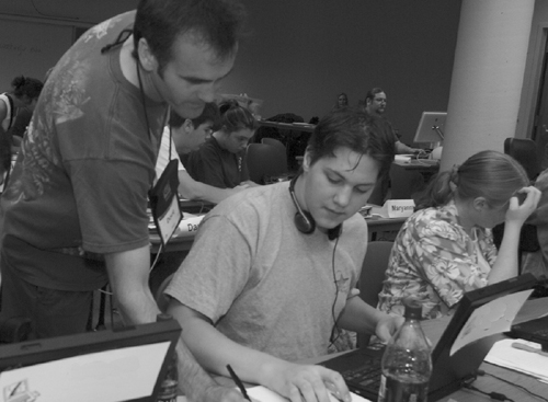 Picture of Doug and a DO-IT Scholar in the computer lab.