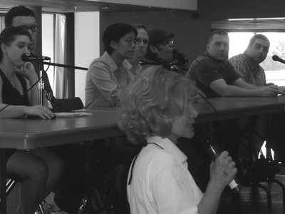 DO-IT Director Sheryl Burgstahler welcomes panelists. Picture of Sheryl in front of panel