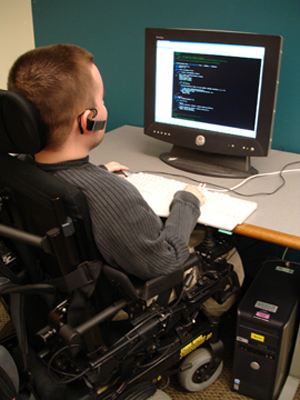 Picture of student in a wheelchair using a computer.