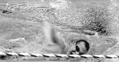 Justin prepares for his trip to Athens. Picture of Justin swimming.