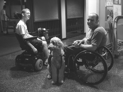 Phase II Scholar Daman talks with Microsoft panelist Steven H. at UW dorm Picture of Daman and Steven at a UW Dorm.
