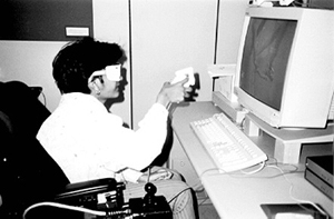 Nadira experiments with virtual reality in the UW Human Interface Technology laboratory Picture of Nadira experimenting with virtual reality