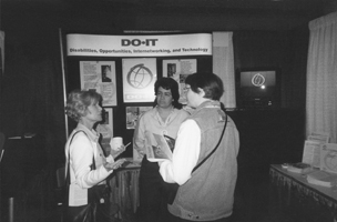 Director Sheryl Burgstahler and Project Coordinator Sara Lopez describe DO-IT to an attendee at the CSUN 2000 conference in LA Picture of Sheryl and Sara at CSUN 2000 conference