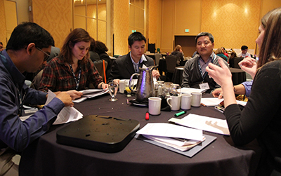 Participants having a discussion around the table.