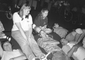 Phase I Scholars find the best positions for observing the laser demonstration at the Pacific Science Center. Picture of scholars reclining on floor