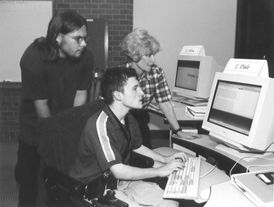 Picture of Caleb, Dale, and Sheryl in computer lab.