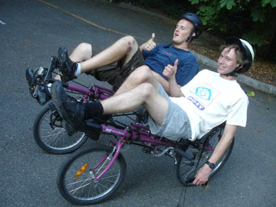 Phase I Scholar Collin and Phase II Scholar Sam bike in the Tour de UW. Picture of Collin and Sam on a modified bike.