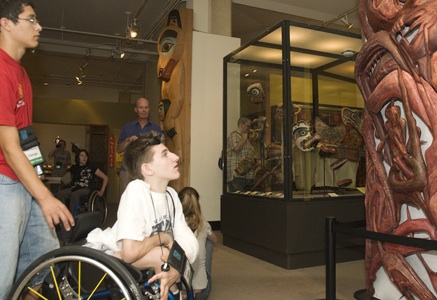 Picture of Nico and Bengy examining an exhibit behind a class case.