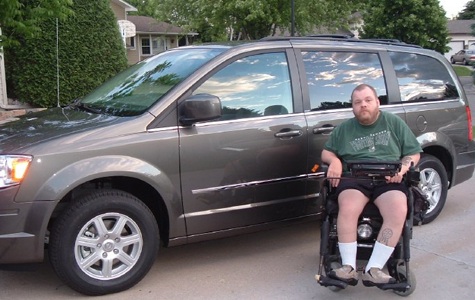 Picture of Anothy in front of his van.