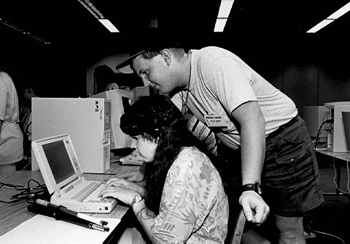 DO-IT Scholars Anna and Lloyd work on an Internet project. Picture of DO-IT Scholars working on an Internet project.