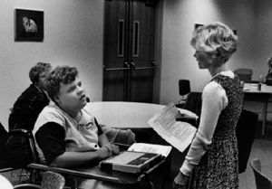 Phase III Scholar Anthony with Director Sheryl Burgstahler discuss the DO-IT summer schedule. Anthony with Sheryl Burgstahler