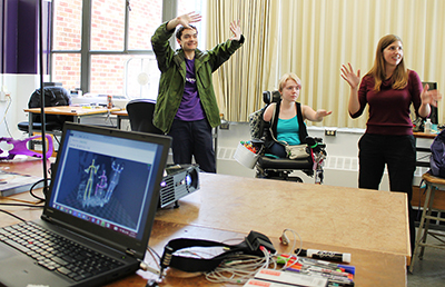1_About_Engineering_Modeling_web.jpg Three students modeling with mapping equipment.