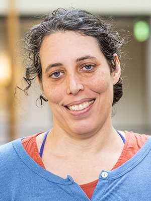 Headshot of Jen Mankoff wearing blue shirt with big smile.