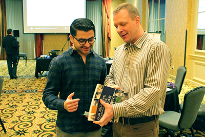 Diversity manager Scott Bellman shows a resource to a participant.