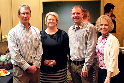 Four AccessERC PIs and participants discuss the event and smile at the camera.