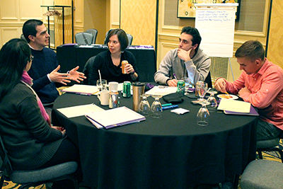 Participants discuss the topic questions. Participants discuss the topic questions.