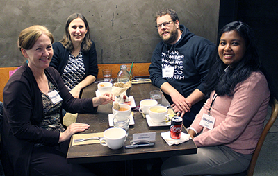 Four participants get to know each other over a meal.