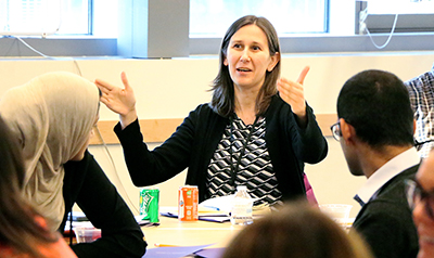 A participant explains a point to the group.