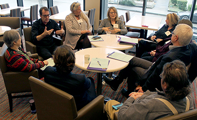 Participants talk about a discussion question in a large group.