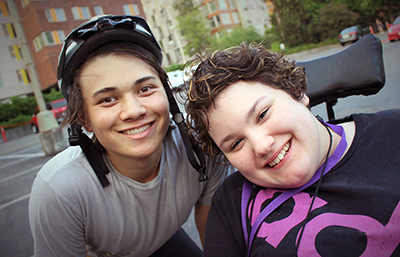 Two students smile for the camera.