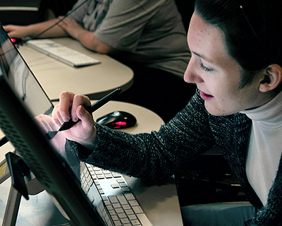 Student using a large desktop tablet Image of a student using a large desktop tablet