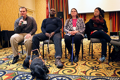 Panelists speak on their disabilities in computing education.