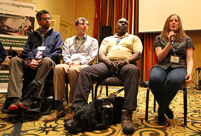 Four panelists speak while passing a microphone.