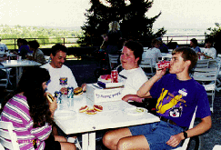 Do-It Scholars, Mentors and volunteers take time to get to know each other at the annual welcome barbecue. Picture of DO-IT Scholars at the annual welcome barbecue.