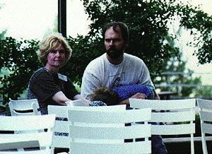 The esteemed director and her husband enjoy Sunday evening music while Travis Burgstahler takes a nap after a long day of chasing mommy and the "doitkids." Picture of the DO-IT Director, Sheryl Burgstahler and her husband.