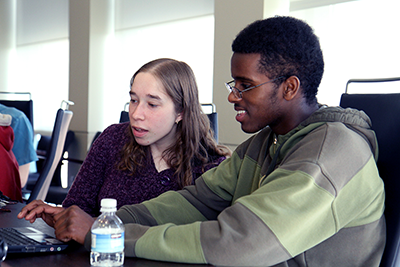 A black student uses a computer