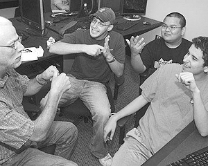 A group of students using sign language to communicate