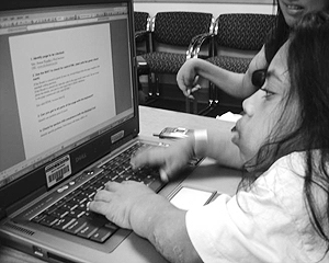 A student using a laptop