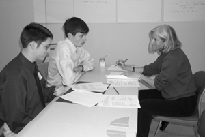 Two students at a disabilities meeting with a career counselor. Image of two students at a disabilities meeting with a career counselor.