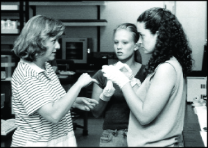 Photo of two students working on a hands-on activity with an instructor.