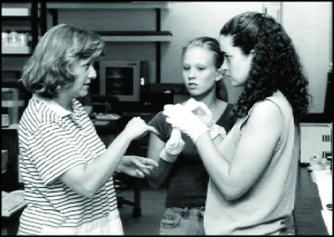 Two students working on a hands-on activity with an instructor. Photo of two students working on a hands-on activity with an instructor.