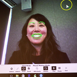 A collaborator shows some assistive facial recognition technology.