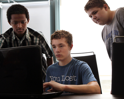 Image of students working on a computing project