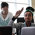 Image of students communicating through sign language during a lab